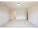 A large, light-filled bedroom with neutral carpet and two walk-in closets at 405 Carrera Ln, Acworth, GA 30102
