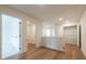 Bright hallway with hardwood floors, leading to a laundry room and closet space at 405 Carrera Ln, Acworth, GA 30102