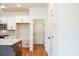Bright eat-in kitchen with white cabinets, tiled backsplash and stainless steel appliances at 405 Carrera Ln, Acworth, GA 30102