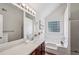 Bright bathroom features a large soaking tub and vanity with a framed mirror at 5273 High Tide Ct, Atlanta, GA 30349