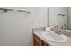 Clean and bright bathroom with a sleek sink, mirror and towel rack at 5273 High Tide Ct, Atlanta, GA 30349