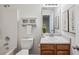 Cozy bathroom features white cabinetry, recessed lighting, and decorative wall art at 5273 High Tide Ct, Atlanta, GA 30349
