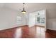 Bright bedroom with hardwood floors and large windows, offering a serene retreat at 5273 High Tide Ct, Atlanta, GA 30349
