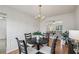 Classic dining room with hardwood floors and direct access to the adjacent living room at 5273 High Tide Ct, Atlanta, GA 30349