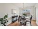 Bright dining room featuring hardwood floors, modern decor, and ample natural light at 5273 High Tide Ct, Atlanta, GA 30349