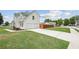 Two-story home featuring an attached two car garage and well manicured lawn and landscaping at 5273 High Tide Ct, Atlanta, GA 30349