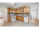 Well-appointed kitchen features tiled floors, white appliances, and wooden cabinetry at 5273 High Tide Ct, Atlanta, GA 30349