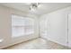 Sunlit bonus room features tile flooring and access to the outdoors at 5273 High Tide Ct, Atlanta, GA 30349