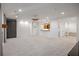 Spacious basement living area featuring plush carpeting, wet bar, and recessed lighting at 9179 Selborne Ln, Chattahoochee Hills, GA 30268