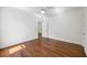 Bright bedroom featuring hardwood floors and modern design at 9179 Selborne Ln, Chattahoochee Hills, GA 30268
