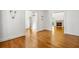 Open living room with fireplace and hardwood floors is bright and open; great for entertaining at 9179 Selborne Ln, Chattahoochee Hills, GA 30268