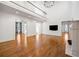 Open living room with high ceilings and a view to the second floor is bright and spacious at 9179 Selborne Ln, Chattahoochee Hills, GA 30268