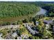 Aerial view of community, with river, mature trees and skyline in background at 1028 Riverbend Club Se Dr, Atlanta, GA 30339