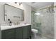 Modern bathroom with a glass-enclosed shower, marble tiling, and elegant vanity at 1028 Riverbend Club Se Dr, Atlanta, GA 30339