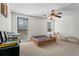 Childs bedroom with natural light, ceiling fan, and minimalist décor at 1028 Riverbend Club Se Dr, Atlanta, GA 30339