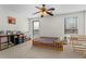 Spacious bedroom with natural light, ceiling fan, and minimalist decor at 1028 Riverbend Club Se Dr, Atlanta, GA 30339