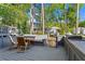 Outdoor deck with comfortable seating and lush green surroundings at 1028 Riverbend Club Se Dr, Atlanta, GA 30339