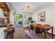 Bright dining area with modern lighting, table, chairs, and access to outdoor deck at 1028 Riverbend Club Se Dr, Atlanta, GA 30339