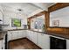 Well-lit kitchen with white cabinets, stainless steel appliances, and ample counter space at 1028 Riverbend Club Se Dr, Atlanta, GA 30339