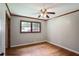 Bright bedroom with hardwood floors and trim, features a window with natural light at 1819 King Alfred Sw Dr, Atlanta, GA 30331