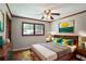 Stylish bedroom featuring hardwood floors, a ceiling fan and tasteful decor at 1819 King Alfred Sw Dr, Atlanta, GA 30331