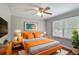 Well-lit bedroom features modern decor, hardwood floors, and a ceiling fan at 1819 King Alfred Sw Dr, Atlanta, GA 30331