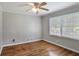 Bedroom with hardwood floors and trim features a window with natural light at 1819 King Alfred Sw Dr, Atlanta, GA 30331