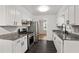 Well-lit kitchen featuring stainless steel appliances, granite countertops, and modern finishes at 1819 King Alfred Sw Dr, Atlanta, GA 30331