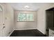Eat-in kitchen with black tile floor and view of the backyard from the window at 1819 King Alfred Sw Dr, Atlanta, GA 30331