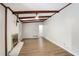 Open living room with hardwood floors and a cozy fireplace at 1819 King Alfred Sw Dr, Atlanta, GA 30331
