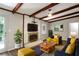 Bright and airy living room with brick fireplace and decorative wooden beams at 1819 King Alfred Sw Dr, Atlanta, GA 30331