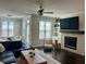 Bright living room featuring a fireplace and large windows, creating a cozy and inviting atmosphere at 2893 Elmwood Dr, Smyrna, GA 30080