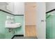 Bathroom sink with classic green and black tile, adjacent to a bedroom at 323 8Th Ne St # 7, Atlanta, GA 30309
