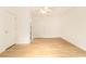 Open bedroom space with hardwood floors, neutral walls, and ceiling fan at 323 8Th Ne St # 7, Atlanta, GA 30309