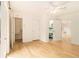 A naturally lit bedroom featuring hardwood floors, neutral walls, and ample closet space at 323 8Th Ne St # 7, Atlanta, GA 30309