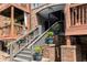 Close-up of the brick stairs to the condo entrance, with potted plants and wooden railings at 323 8Th Ne St # 7, Atlanta, GA 30309