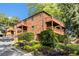 Brick condo building with wooden balconies and greenery at 323 8Th Ne St # 7, Atlanta, GA 30309