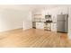 Cozy kitchen featuring white cabinets and stainless steel appliances plus open floor plan at 323 8Th Ne St # 7, Atlanta, GA 30309