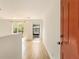 Bright living room with hardwood floors, access to a balcony, and ample natural light at 323 8Th Ne St # 7, Atlanta, GA 30309