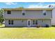 Backyard view showcasing the house's exterior and a large lawn at 4065 Waters End Ln, Snellville, GA 30039