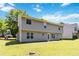 Exterior view of a two-story house with a spacious green backyard on a sunny day at 4065 Waters End Ln, Snellville, GA 30039
