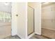 Primary bathroom featuring stand-up shower, walk-in closet, and access to bedroom at 4065 Waters End Ln, Snellville, GA 30039