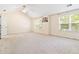 Spacious bedroom features neutral carpet, vaulted ceilings, ceiling fan, and lots of natural light at 4065 Waters End Ln, Snellville, GA 30039