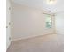 Bedroom with neutral carpet, one window, and white walls at 4065 Waters End Ln, Snellville, GA 30039