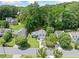 Aerial view showcasing the home's landscaping and surrounding trees in the community at 5590 Princeton Oaks Dr, Sugar Hill, GA 30518
