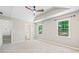 Bright and airy bedroom features carpeted floor, vaulted ceiling and multiple windows at 5590 Princeton Oaks Dr, Sugar Hill, GA 30518