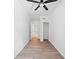 A simple bedroom features neutral paint and ceiling fan at 5590 Princeton Oaks Dr, Sugar Hill, GA 30518