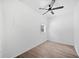 A simple bedroom features neutral paint and ceiling fan at 5590 Princeton Oaks Dr, Sugar Hill, GA 30518