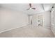Bright and airy bedroom features carpeted floor, vaulted ceiling and ceiling fan at 5590 Princeton Oaks Dr, Sugar Hill, GA 30518