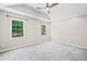 Large bedroom with a ceiling fan and multiple windows at 5590 Princeton Oaks Dr, Sugar Hill, GA 30518
